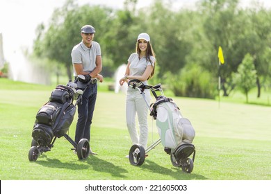 Young Couple Playing Golf