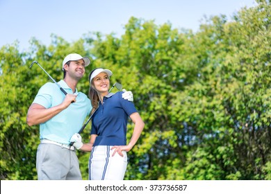 Young Couple Playing Golf