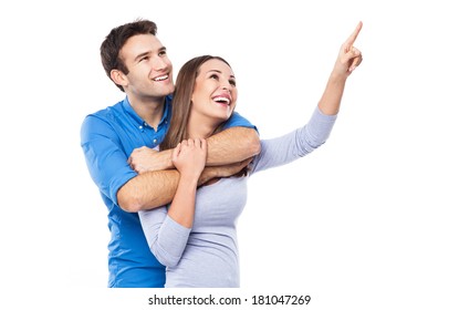 Young Couple Pointing Up 