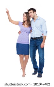 Young Couple Pointing Up 