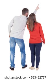 Young Couple Pointing At Wal Back View  (woman And Man). Rear View People Collection.  Backside View Of Person.  Isolated Over White Background.