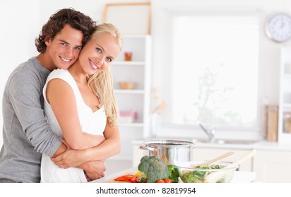 Young Couple Posing In Their Kitchen