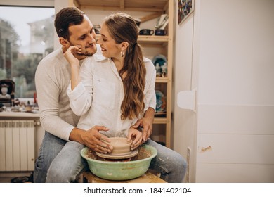 Young Couple At A Pottery Class Together