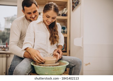 Young Couple At A Pottery Class Together