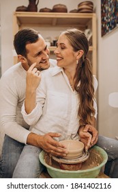 Young Couple At A Pottery Class Together