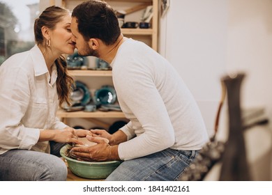 Young couple at a pottery class together - Powered by Shutterstock