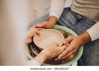 Young Couple At A Pottery Class Together