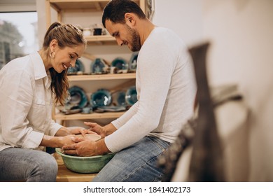 Young Couple At A Pottery Class Together