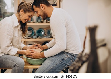 Young Couple At A Pottery Class Together