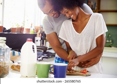 Young Couple Preparing Breakfast In Kitchen Together - Powered by Shutterstock