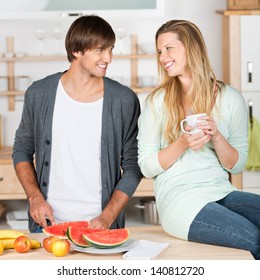 Young Couple Preparing Something To Eat In The Kitchen