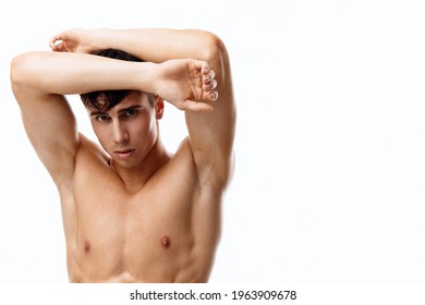 Young Couple With Pumped Up Muscles Bodybuilder Hands Behind Head And White Background