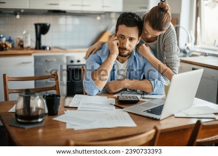 Young couple reading bad financial report having financial debt at home