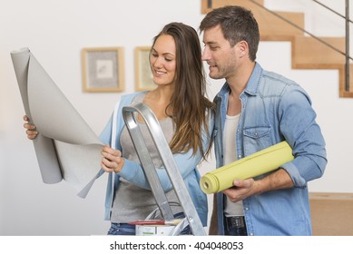 Young Couple Ready To Reform House