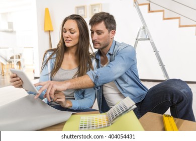 Young Couple Ready To Reform House