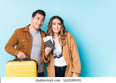 Young Couple Ready For A Travel Isolated Confused, Feels Doubtful And Unsure.