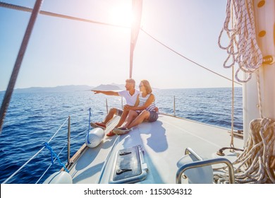 Young Couple Relaxing On The Yacht Cruise. Travel Adventure, Yachting Vacation.