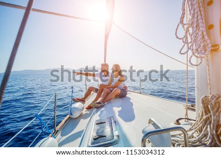 Young couple relaxing on the yacht cruise. Travel adventure, yachting vacation.