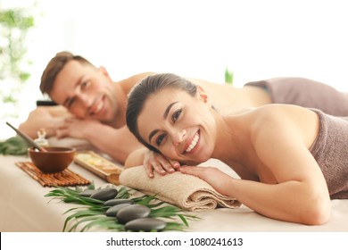 Young Couple Relaxing In Spa Salon