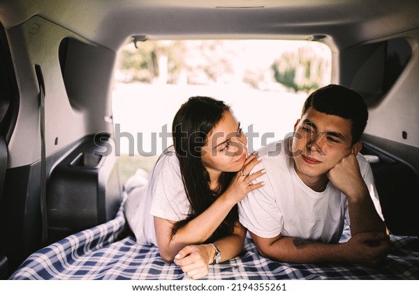 young couple resting in\
car