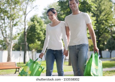 Young Couple With Reusable Bags