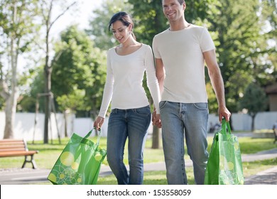 Young Couple With Reusable Bags