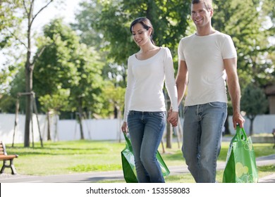 Young Couple With Reusable Bags