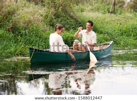 Young couple in a rowing boat