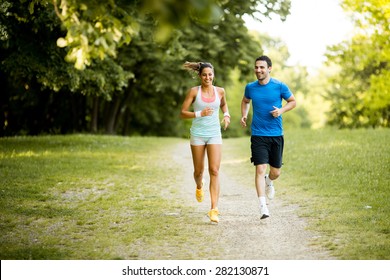 Young couple running - Shutterstock ID 282130871