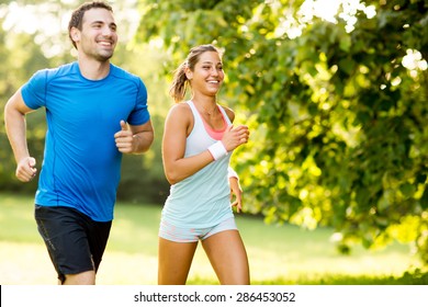 Young couple running - Shutterstock ID 286453052
