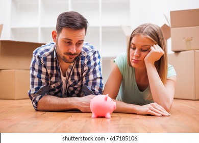 Young Couple Is Saving Money For Their New Home.