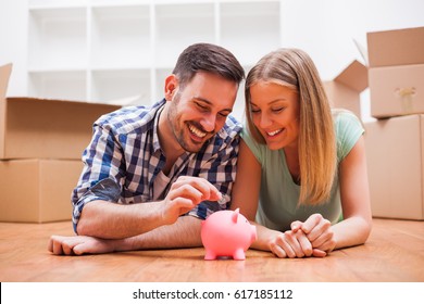 Young Couple Is Saving Money For Their New Home.