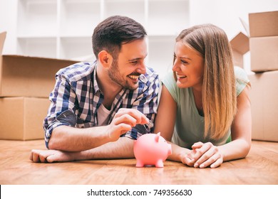 Young Couple Is Saving Money For Their New Home.