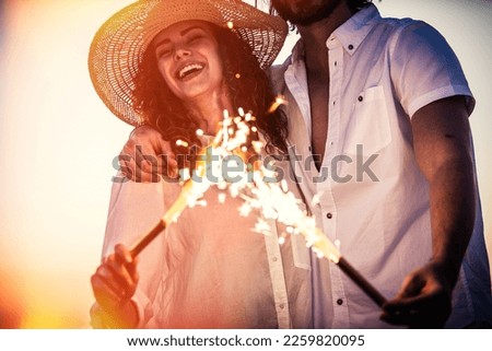 Young couple sharing happy  and love mood on the beach. Happy man and woman on their honeymoon vacation
