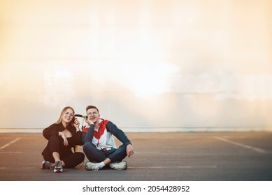 Young Couple Sharing Headphones, Music Streaming Concept