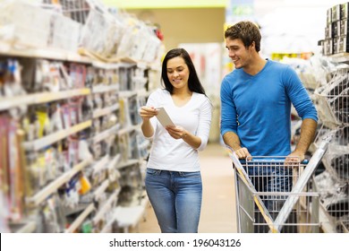 Young Couple Shopping For DIY Tools At Hardware Store