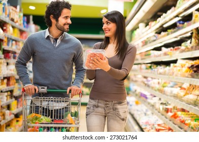 Young couple shopping in a supermarket - Powered by Shutterstock