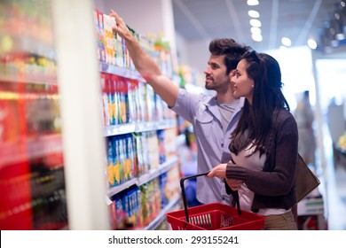 Young Couple Shopping In A Supermarket