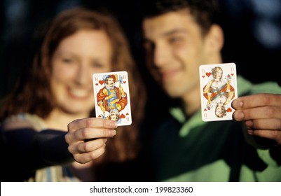 Young Couple Showing Playing Cards