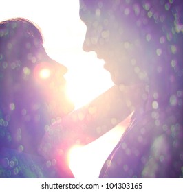 Young Couple Silhouette Hugging And Looking At Each Other Outdoors At Night Neon City Background