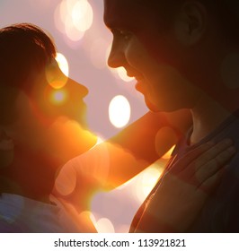 Young Couple Silhouette Hugging And Looking At Each Other Outdoors At Night Neon City Background