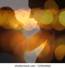 Young Couple Silhouette Hugging And Looking At Each Other Outdoors At Night Neon City Background