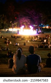 Young Couple Silhouettes Enjoying On Outdoor Concert At Night