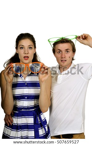 Young couple with silly goofy over sized glasses