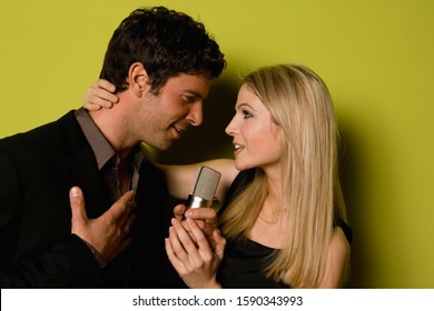 Young Couple Singing A Duet