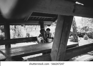 Young couple. I sit with a blanket in the gazebo. Autumn. - Powered by Shutterstock