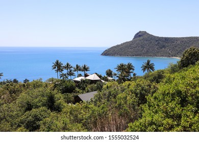 Young Couple Sitting Looking Out Over Passage Peak On Hamilton Island