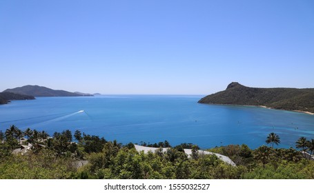 Young Couple Sitting Looking Out Over Passage Peak On Hamilton Island