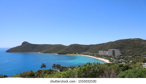 Young Couple Sitting Looking Out Over Passage Peak On Hamilton Island