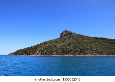 Young Couple Sitting Looking Out Over Passage Peak On Hamilton Island